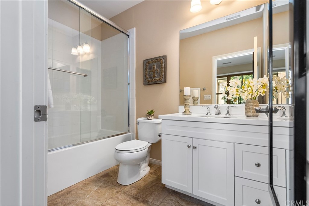 97 Mayfair Irvine, CA 92620 - Photo 20 of 42 a bathroom with a sink toilet and shower