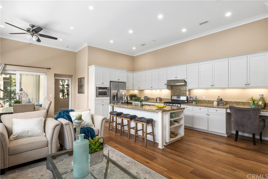 97 Mayfair Irvine, CA 92620 - Photo 2 of 42 a living room with stainless steel appliances furniture and a kitchen view