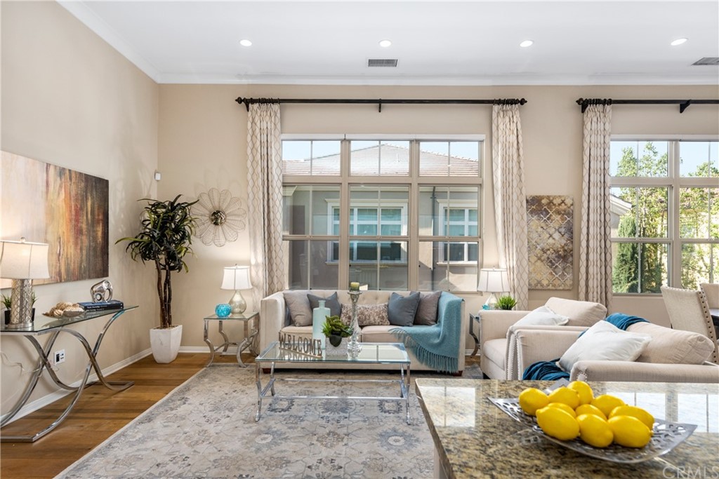 97 Mayfair Irvine, CA 92620 - Photo 9 of 42 a living room with furniture and a large window