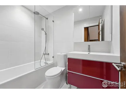 a bathroom with a toilet a sink and shower