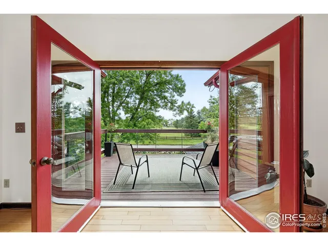 a view of a room with a porch and furniture