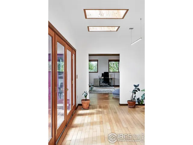 a living room with kitchen island furniture and a kitchen view