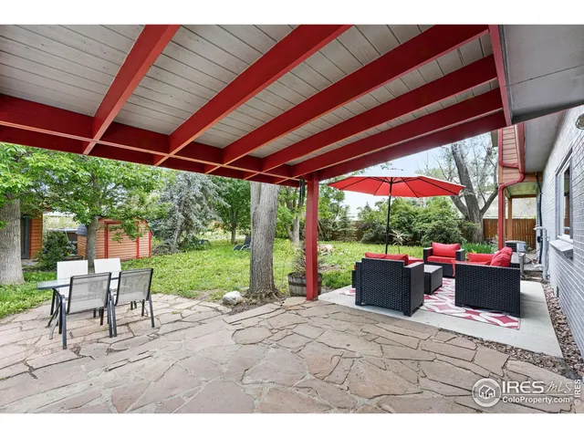 a view of yard with patio