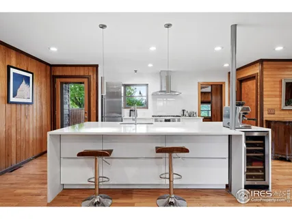 a kitchen with a sink cabinets and window
