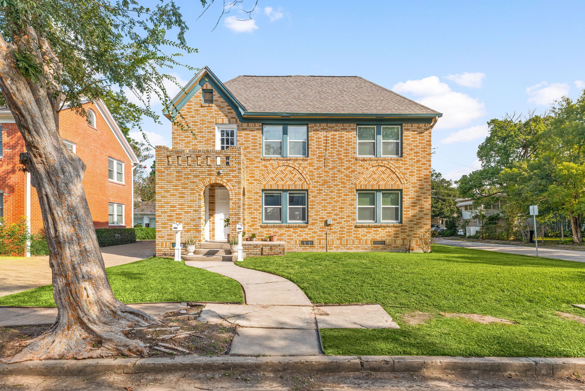 a front view of a house with a yard