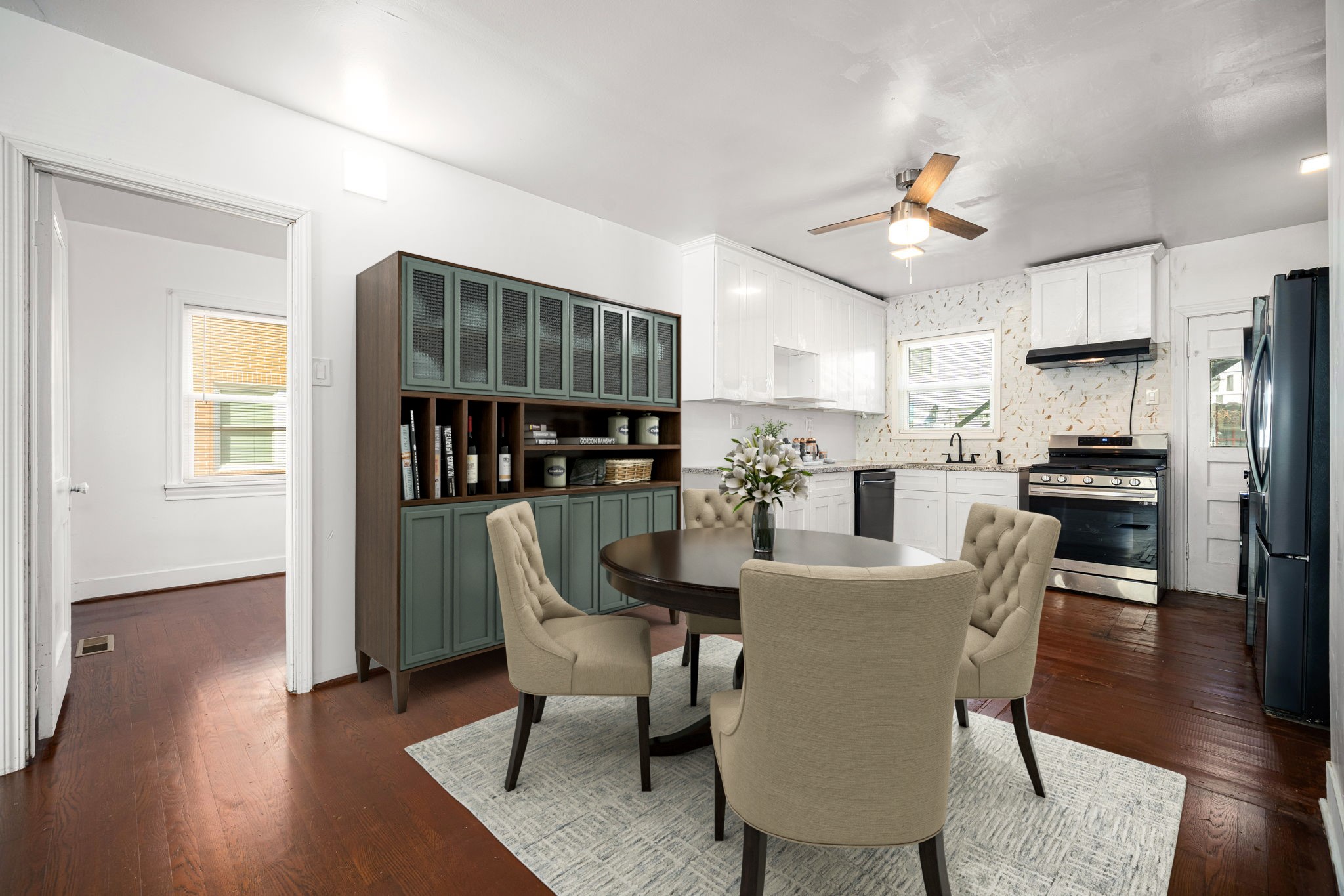 1202 Barkdull Street Houston, TX 77006 - Photo 11 of 48 a view of kitchen with refrigerator and wooden floor