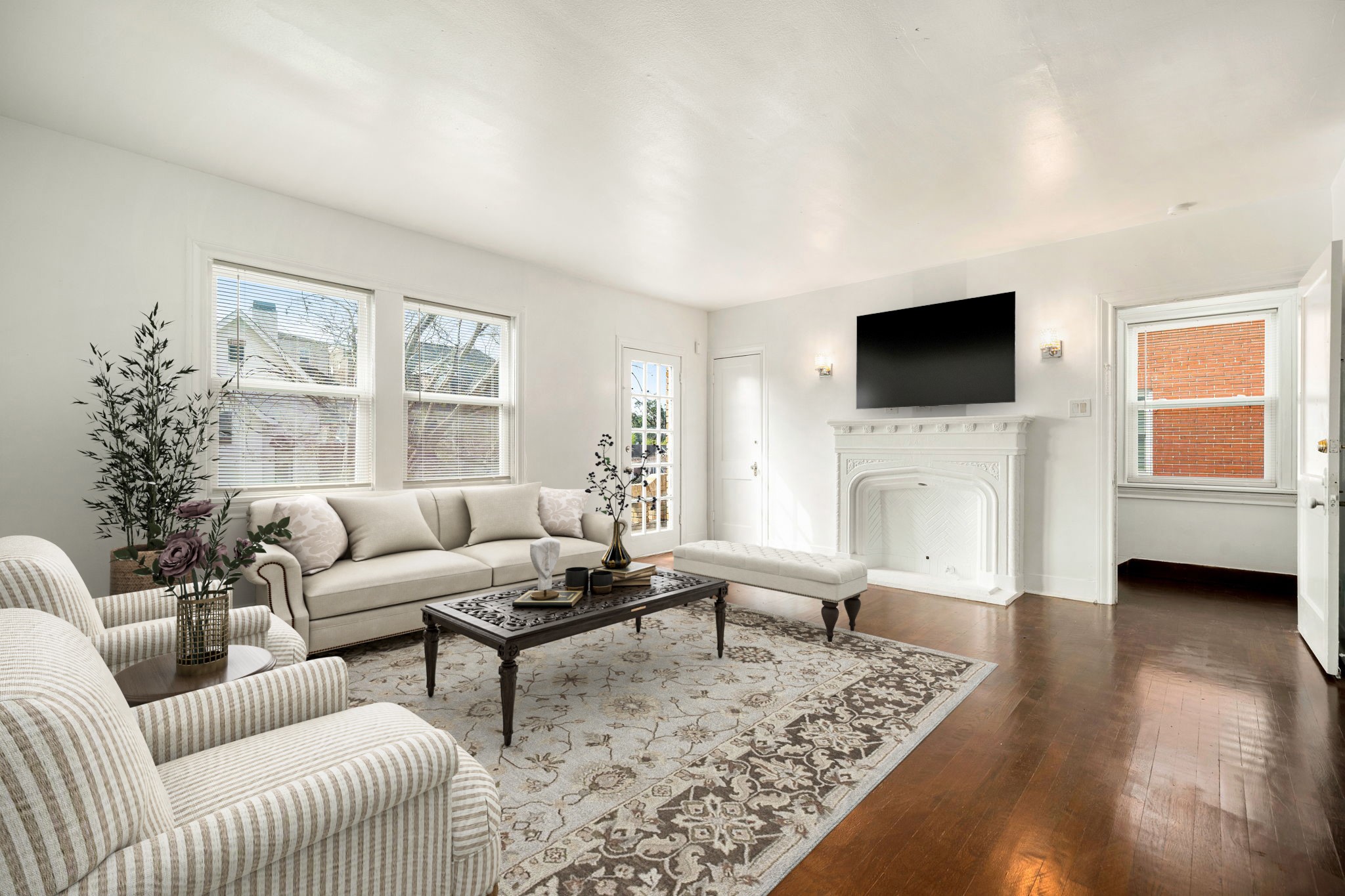 1202 Barkdull Street Houston, TX 77006 - Photo 23 of 48 a living room with furniture a flat screen tv and a fireplace