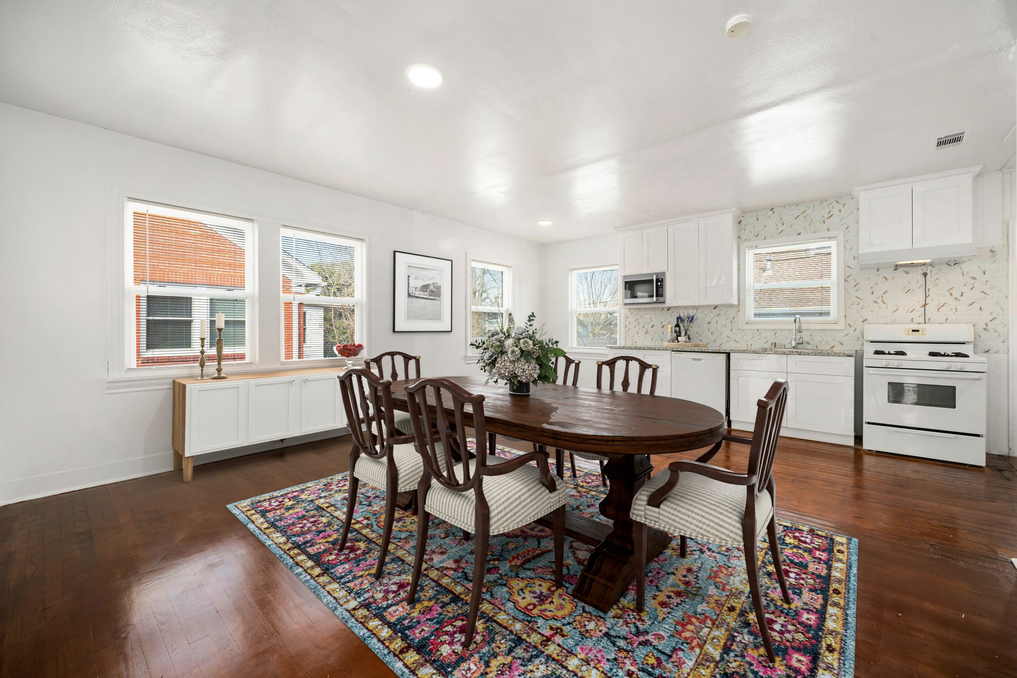 1202 Barkdull Street Houston, TX 77006 - Photo 30 of 48 a view of a dining room with furniture and wooden floor
