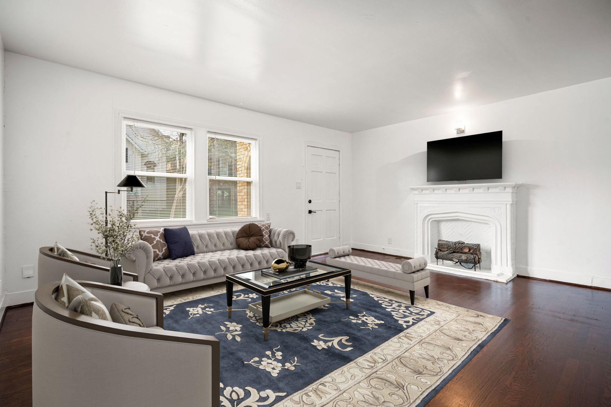 1202 Barkdull Street Houston, TX 77006 - Photo 5 of 48 a living room with furniture a fireplace and a flat screen tv