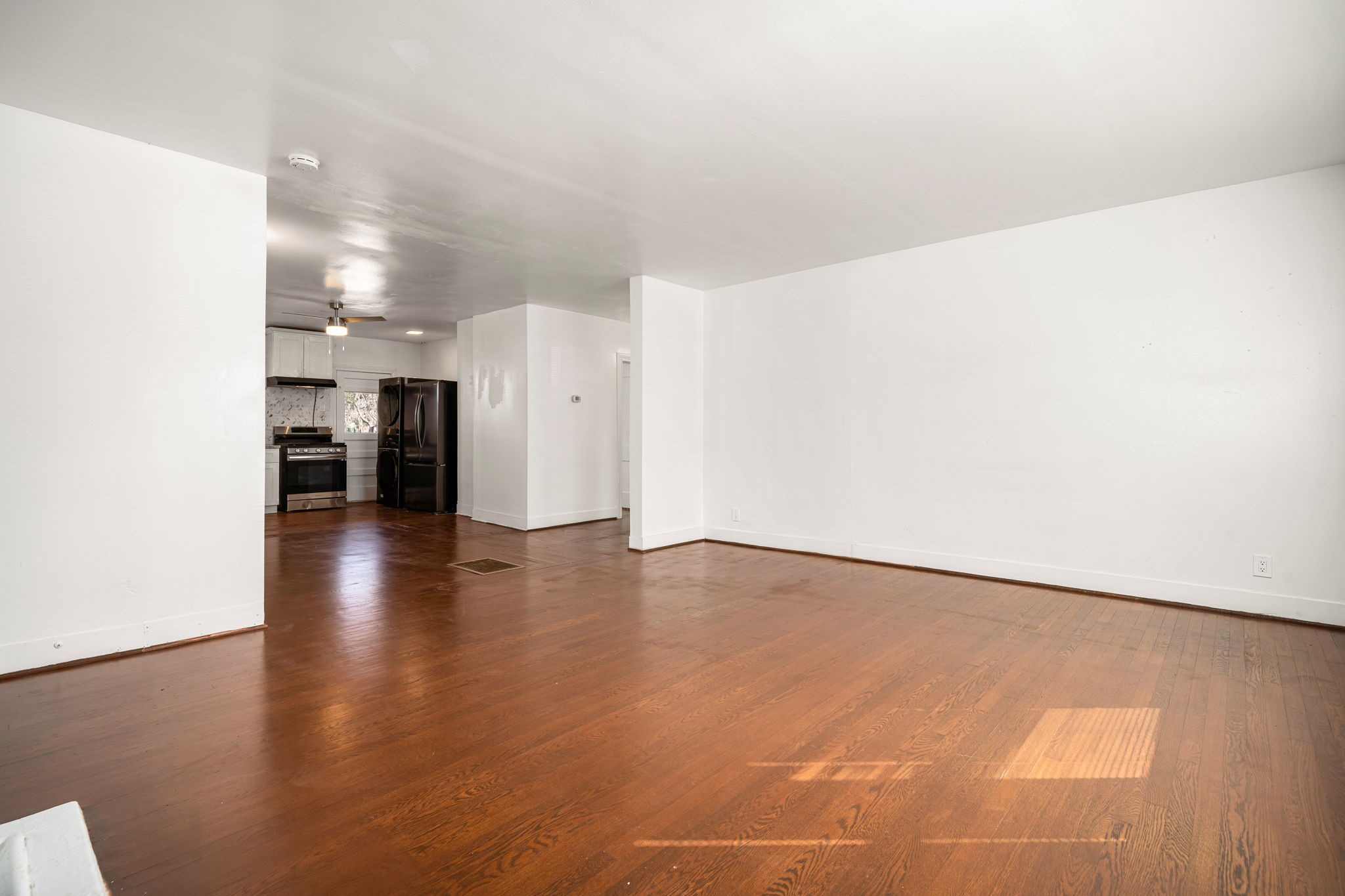 1202 Barkdull Street Houston, TX 77006 - Photo 6 of 48 a view of an empty room with wooden floor