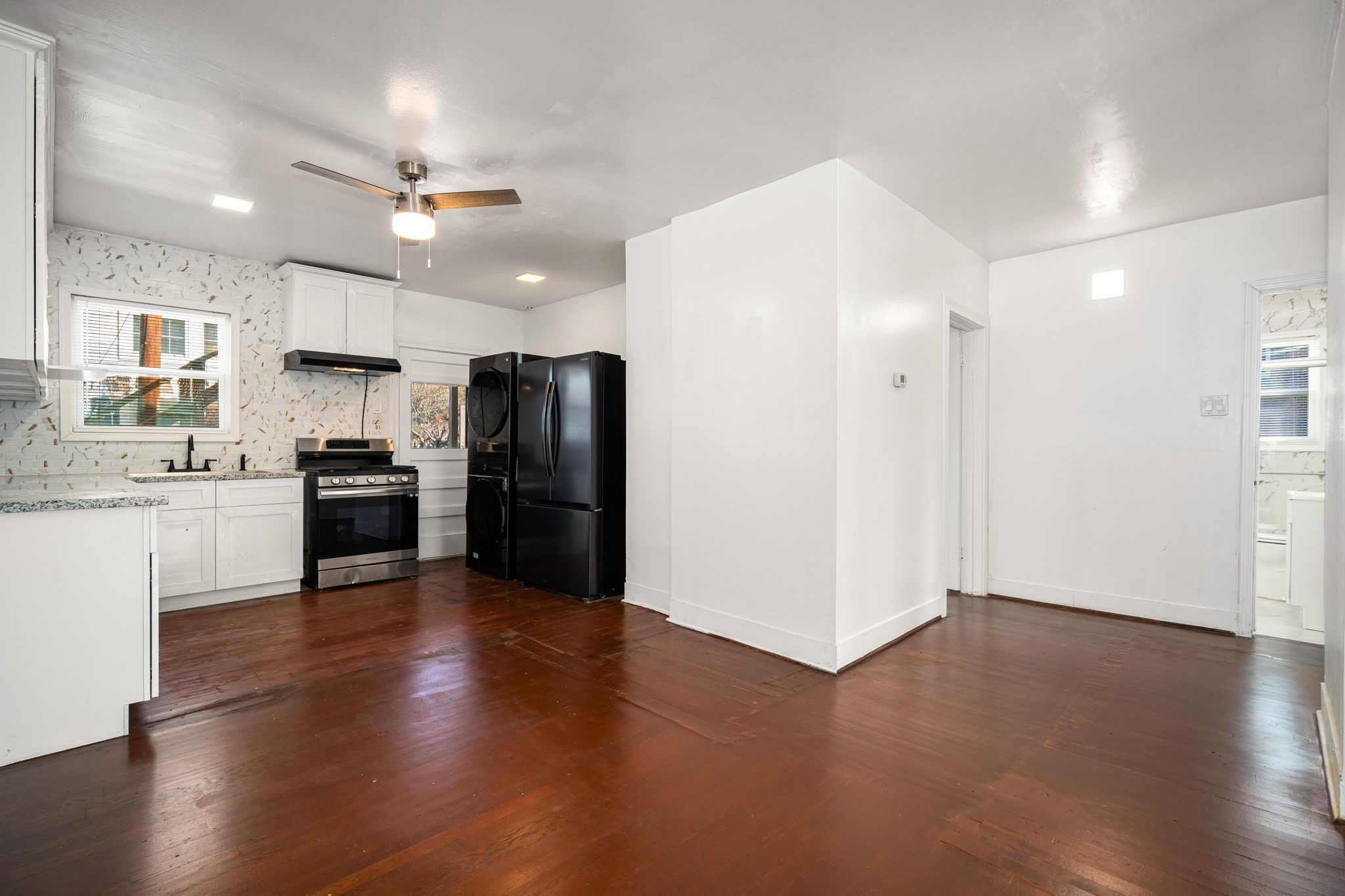 1202 Barkdull Street Houston, TX 77006 - Photo 7 of 48 a kitchen with a refrigerator and a sink
