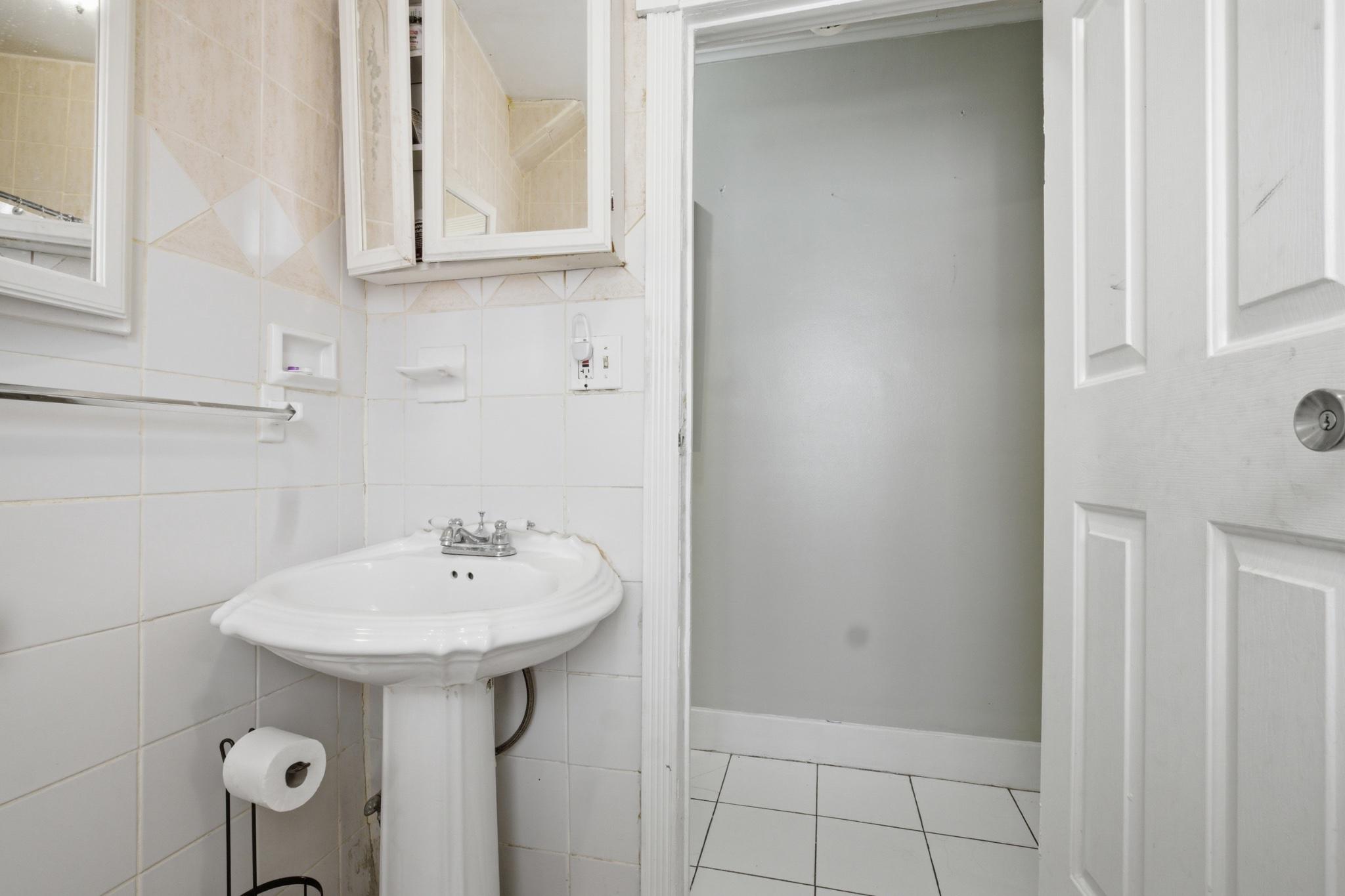 1330 Church Street Reading, PA 19601 - Photo 11 of 16 a bathroom with a sink and a mirror