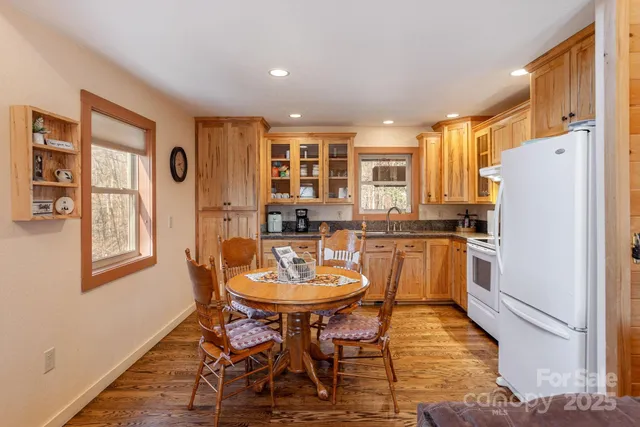 a kitchen with a sink window and cabinets