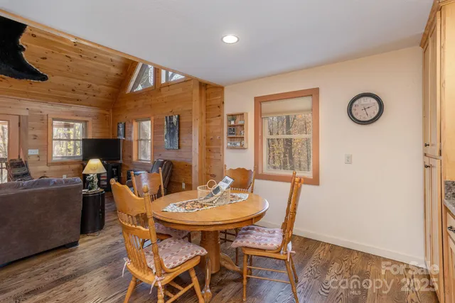 a spacious bedroom with a bed and large windows