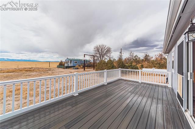 22885 Handle Road Calhan, CO 80808 - Photo 4 of 38 Wooden terrace with a rural view