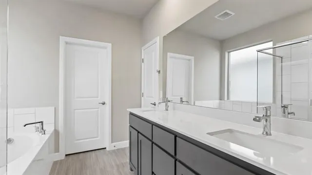 an empty room with closet and a chandelier fan