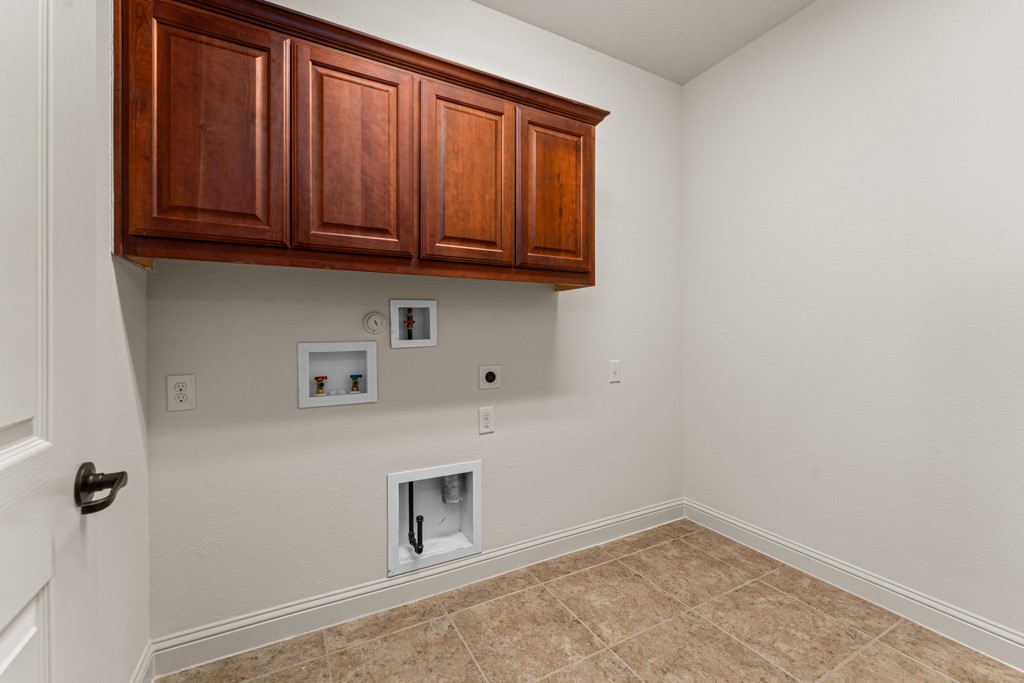 651 Shelf Rock Road Driftwood, TX 78619 - Photo 15 of 38 a view of storage and utility room with washer and dryer