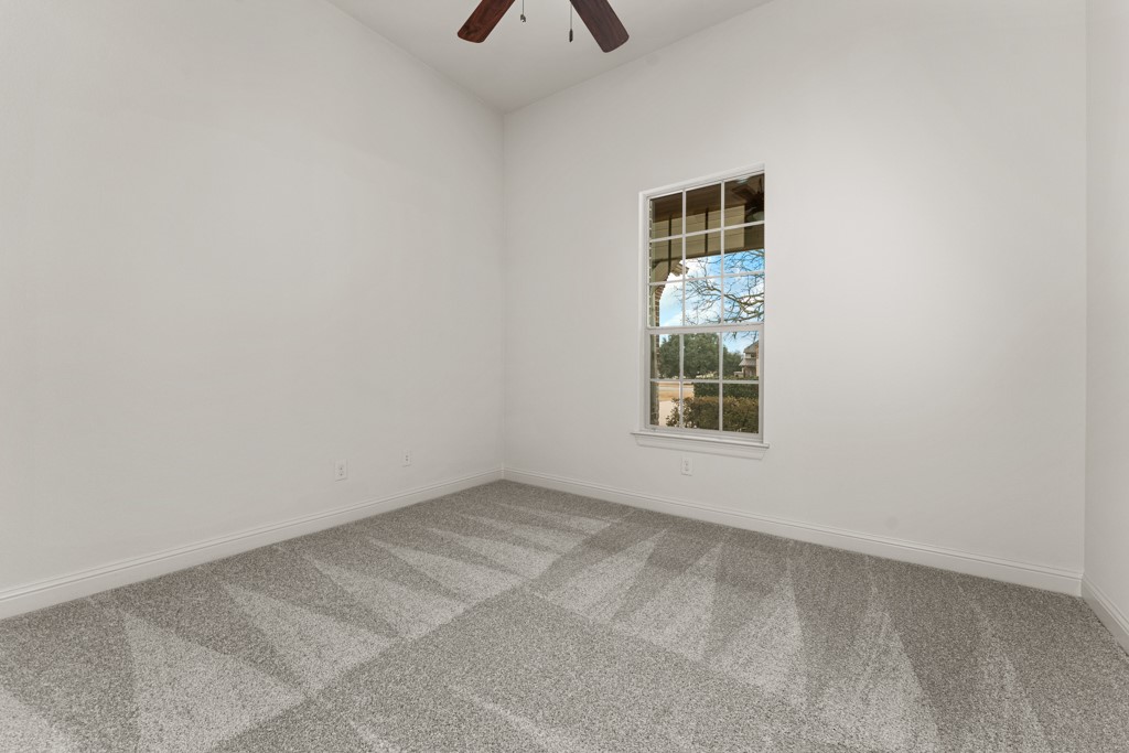 651 Shelf Rock Road Driftwood, TX 78619 - Photo 19 of 38 a view of an empty room with a window