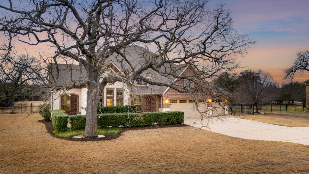 651 Shelf Rock Road Driftwood, TX 78619 - Photo 3 of 38 a view of white house with a large tree