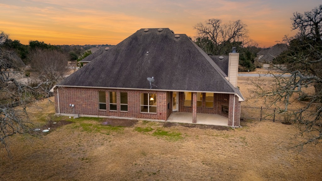 651 Shelf Rock Road Driftwood, TX 78619 - Photo 33 of 38 front view of a house with a yard