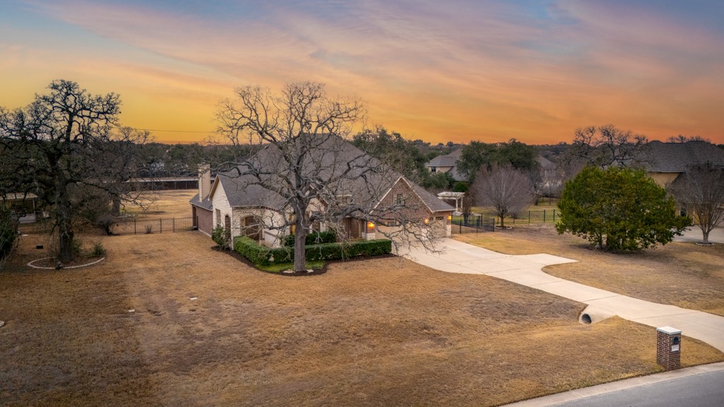 651 Shelf Rock Road Driftwood, TX 78619 - Photo 34 of 38 a view of a backyard with large trees