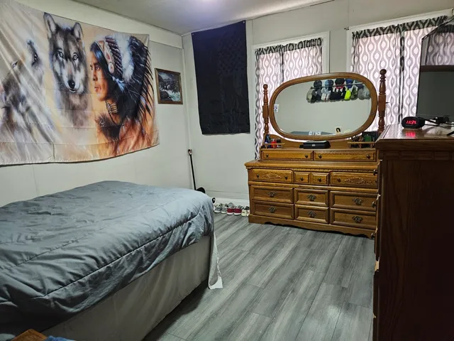 a kitchen with a refrigerator and cabinets