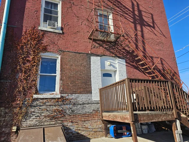 a view of a brick building with many windows