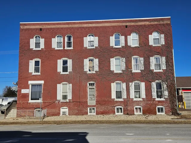 a front view of building with multiple windows