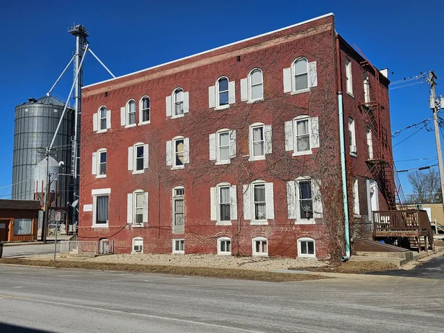 a front view of a building with street view