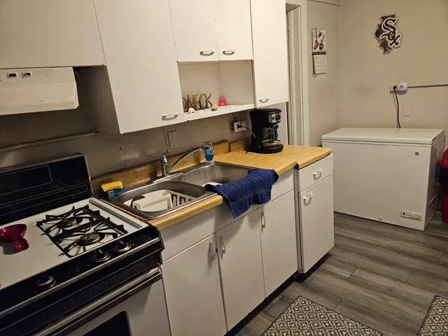 a living room with furniture and a mirror