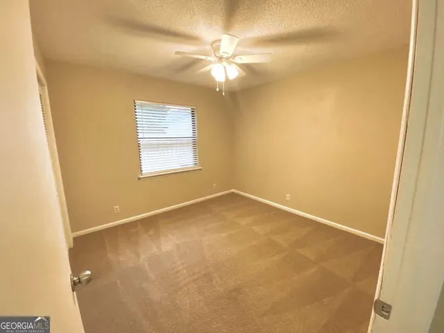 en view of an empty room with a window