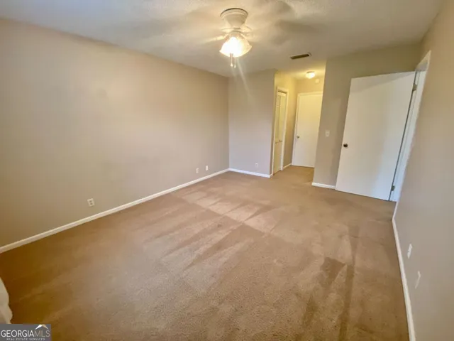 an empty room with a bathroom