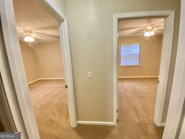 a bathroom with a sink a toilet and shower a mirror