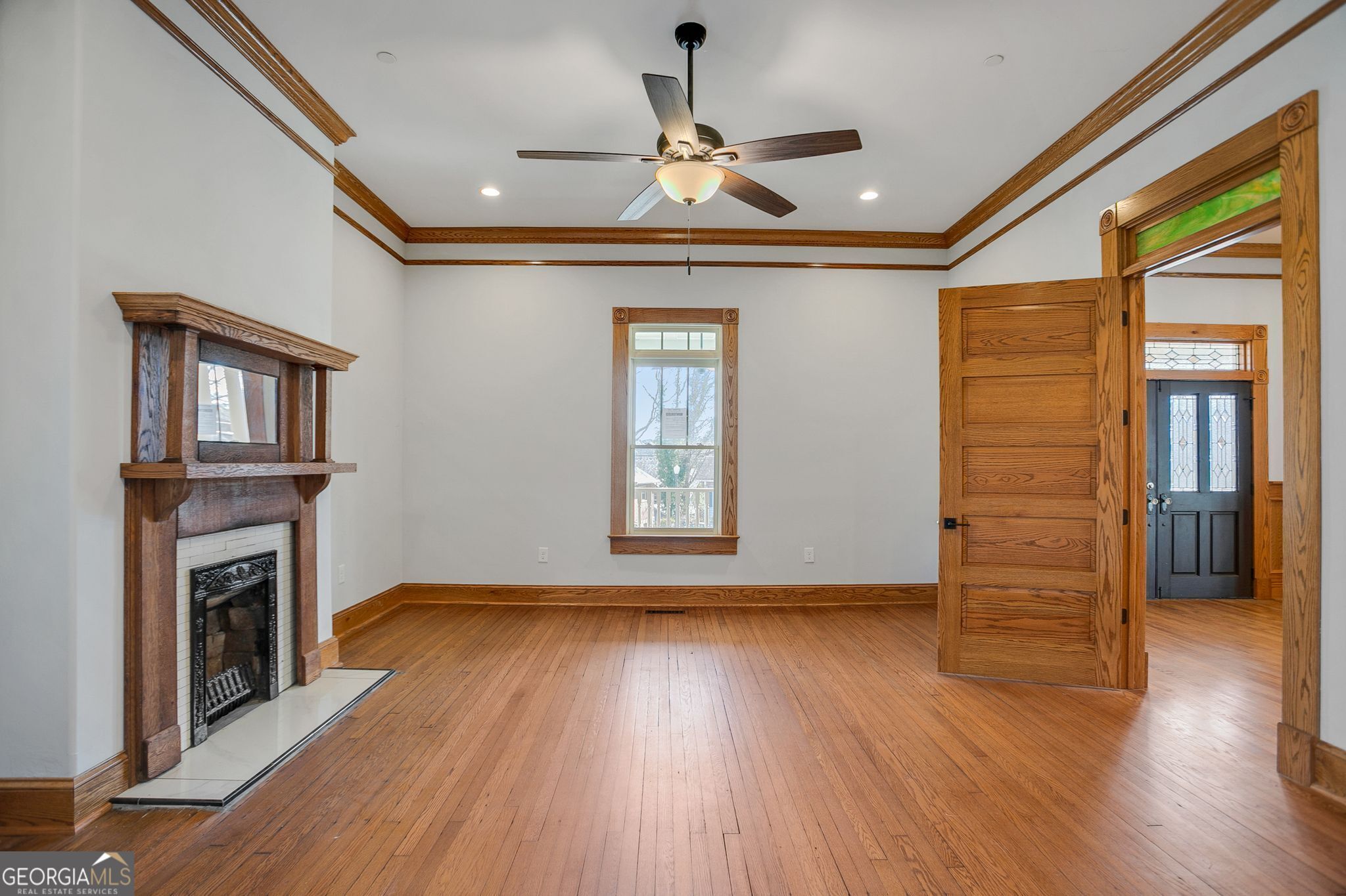 2 Coral Avenue Southwest Rome, GA 30161 - Photo 16 of 50 a view of an empty room with wooden floor fireplace and a window