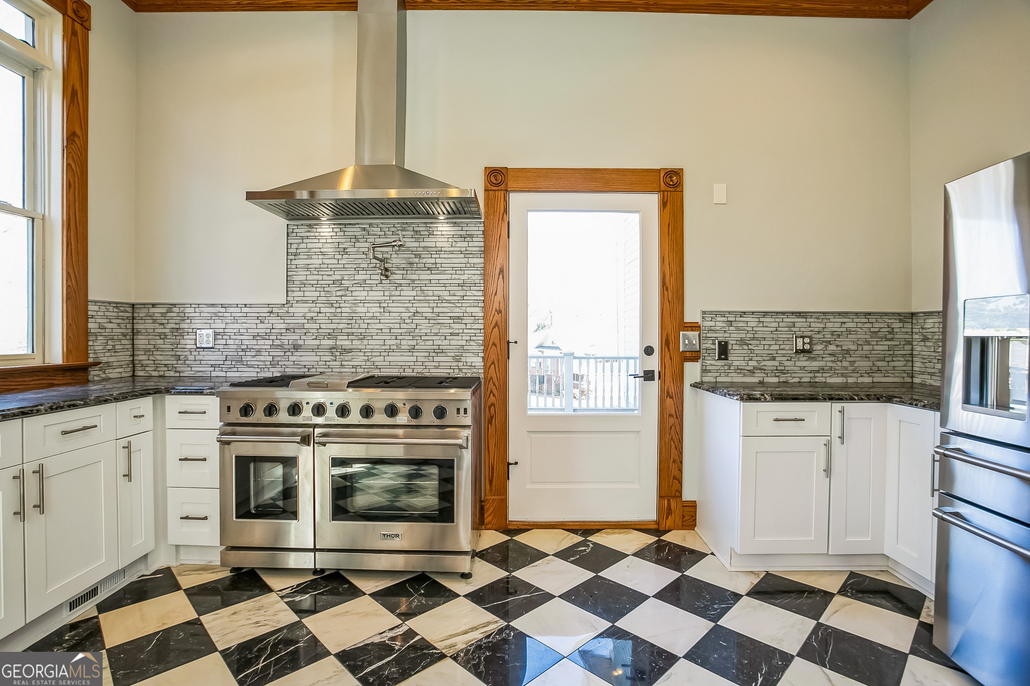2 Coral Avenue Southwest Rome, GA 30161 - Photo 18 of 50 a kitchen with a stove a sink and a refrigerator