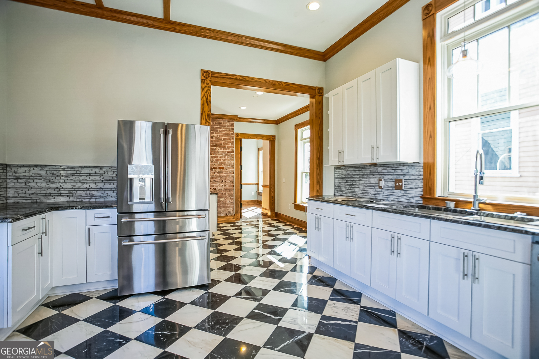 2 Coral Avenue Southwest Rome, GA 30161 - Photo 21 of 50 a kitchen with a checkered floor and a refrigerator