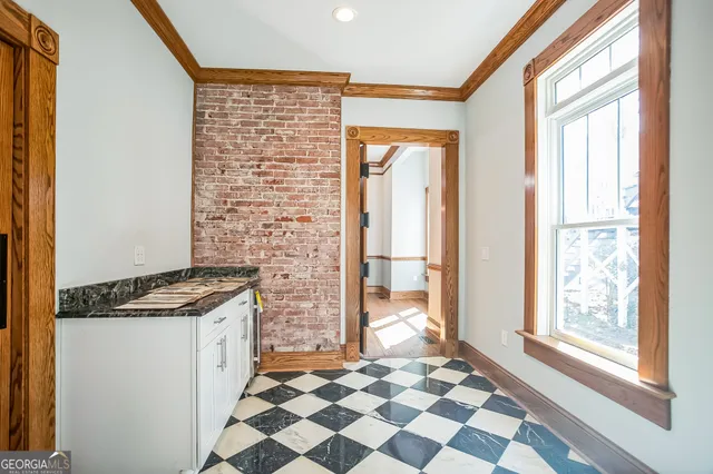 a kitchen with granite countertop a stove top oven and a sink