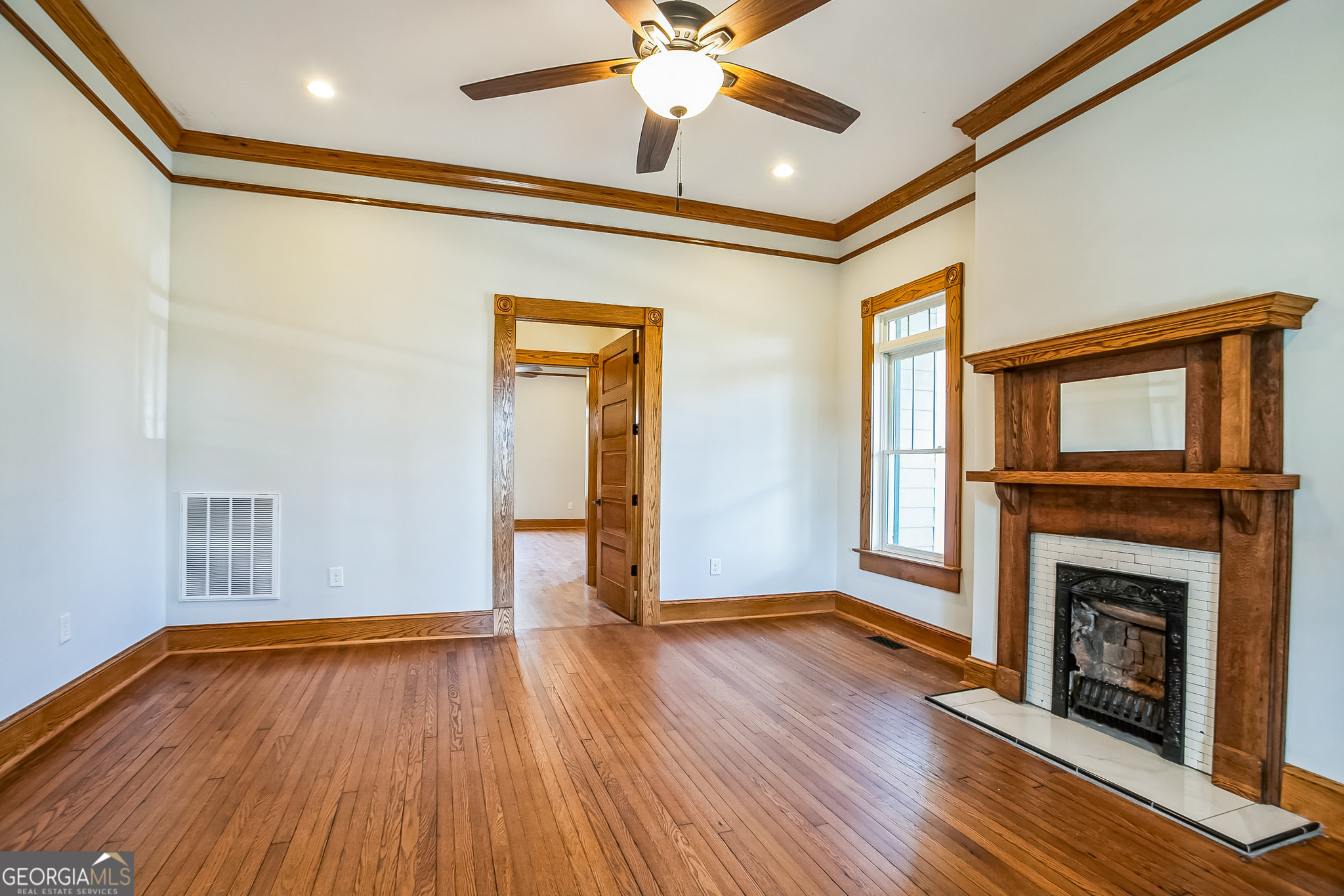 2 Coral Avenue Southwest Rome, GA 30161 - Photo 25 of 50 a view of empty room with a fireplace and wooden floor