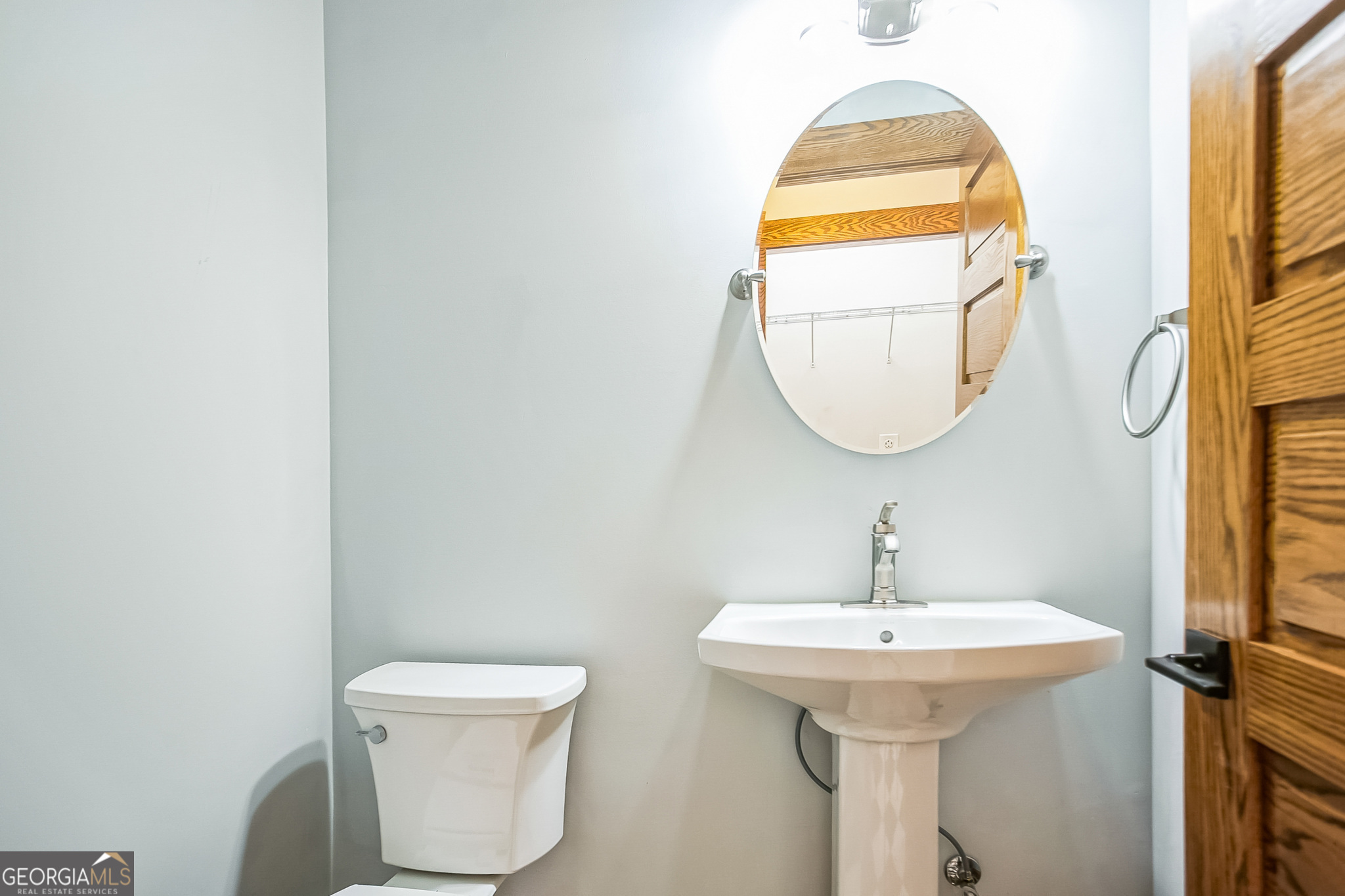 2 Coral Avenue Southwest Rome, GA 30161 - Photo 49 of 50 a bathroom with a toilet sink and mirror