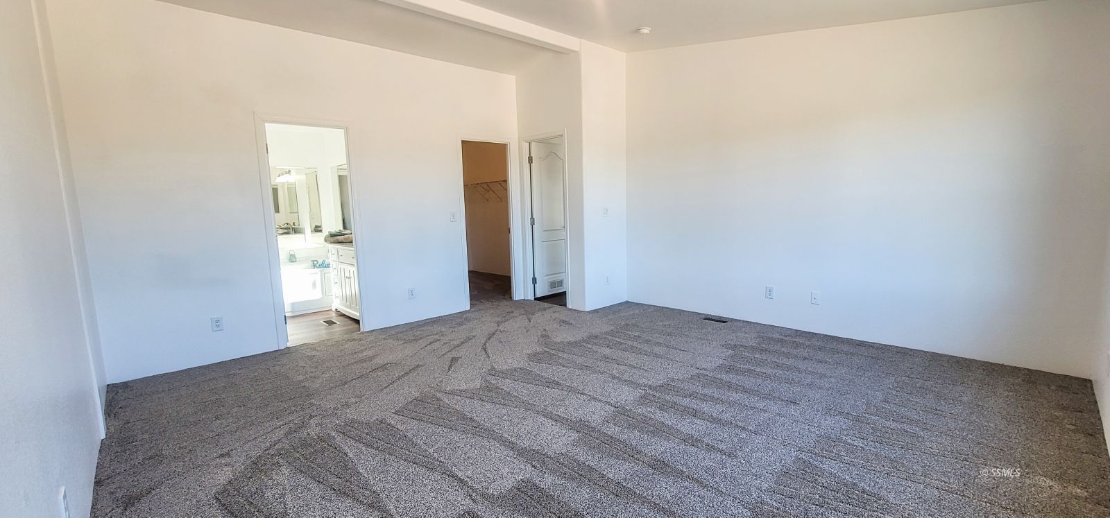 1056 North Alford Street Ridgecrest, CA 93555 - Photo 17 of 24 an empty room with closet and wooden floor