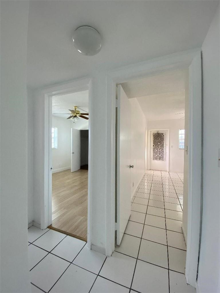 1855 Plunkett Street, Unit 101 Hollywood, FL 33020 - Photo 11 of 25 a view of a hallway