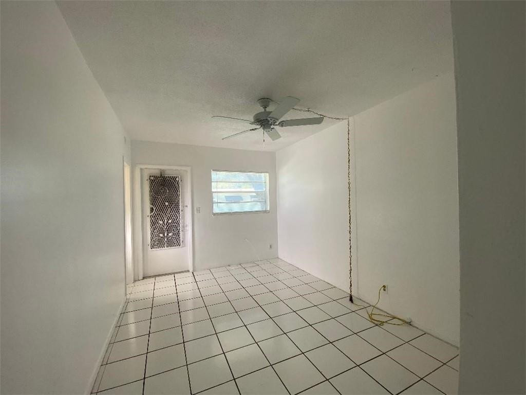 1855 Plunkett Street, Unit 101 Hollywood, FL 33020 - Photo 12 of 25 a view of an empty room and a window