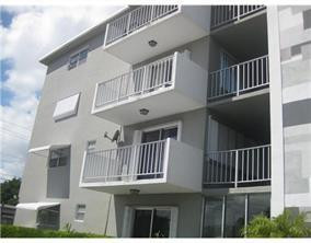 1855 Plunkett Street, Unit 101 Hollywood, FL 33020 - Photo 2 of 25 a view of a house with a deck