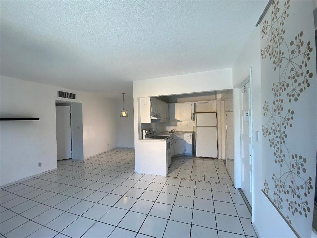 1855 Plunkett Street, Unit 101 Hollywood, FL 33020 - Photo 10 of 25 a view of a kitchen with a sink