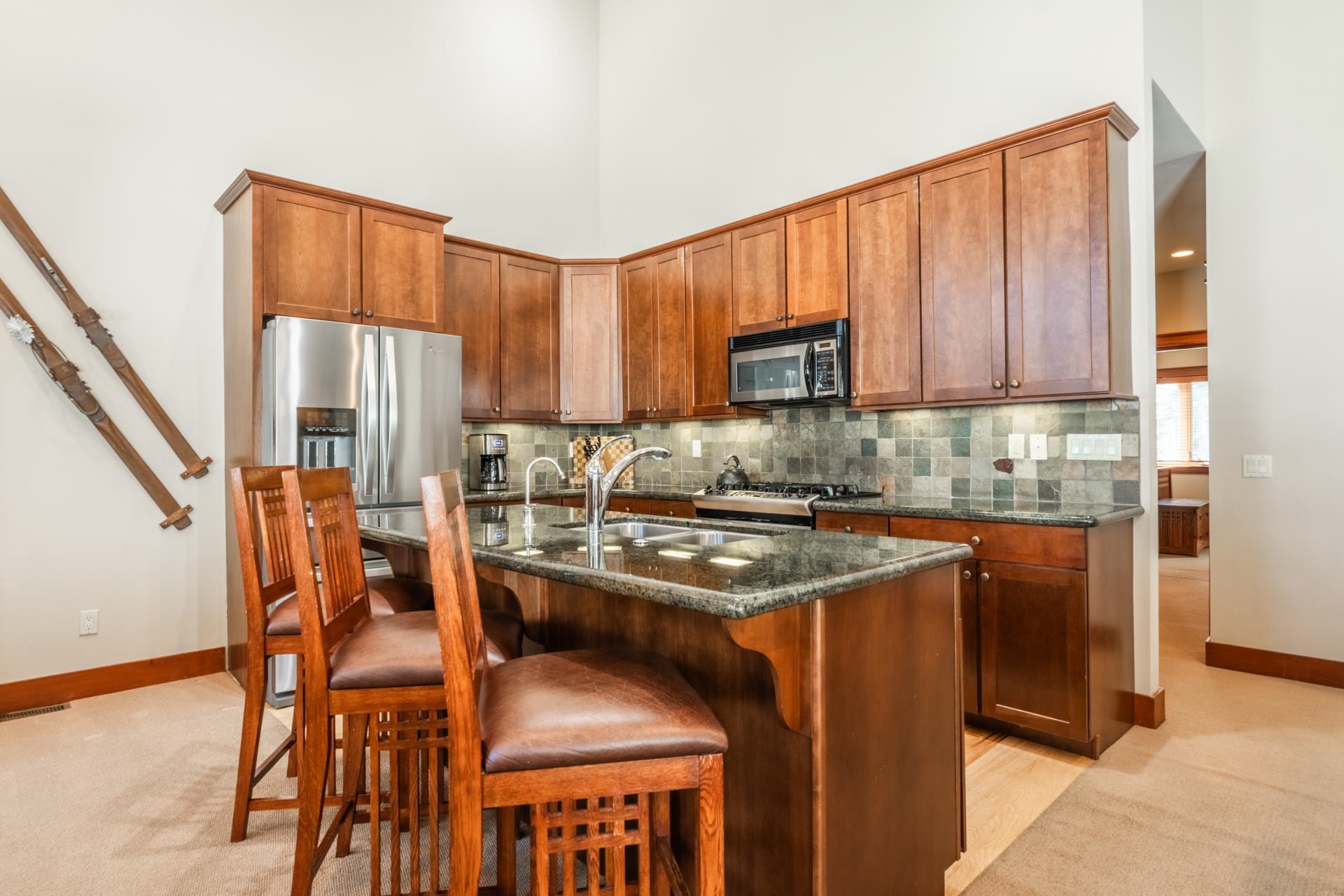 125 Davison Road, Unit 2 Mammoth Lakes, CA 93546 - Photo 14 of 50 a kitchen with stainless steel appliances granite countertop a stove a sink and a refrigerator