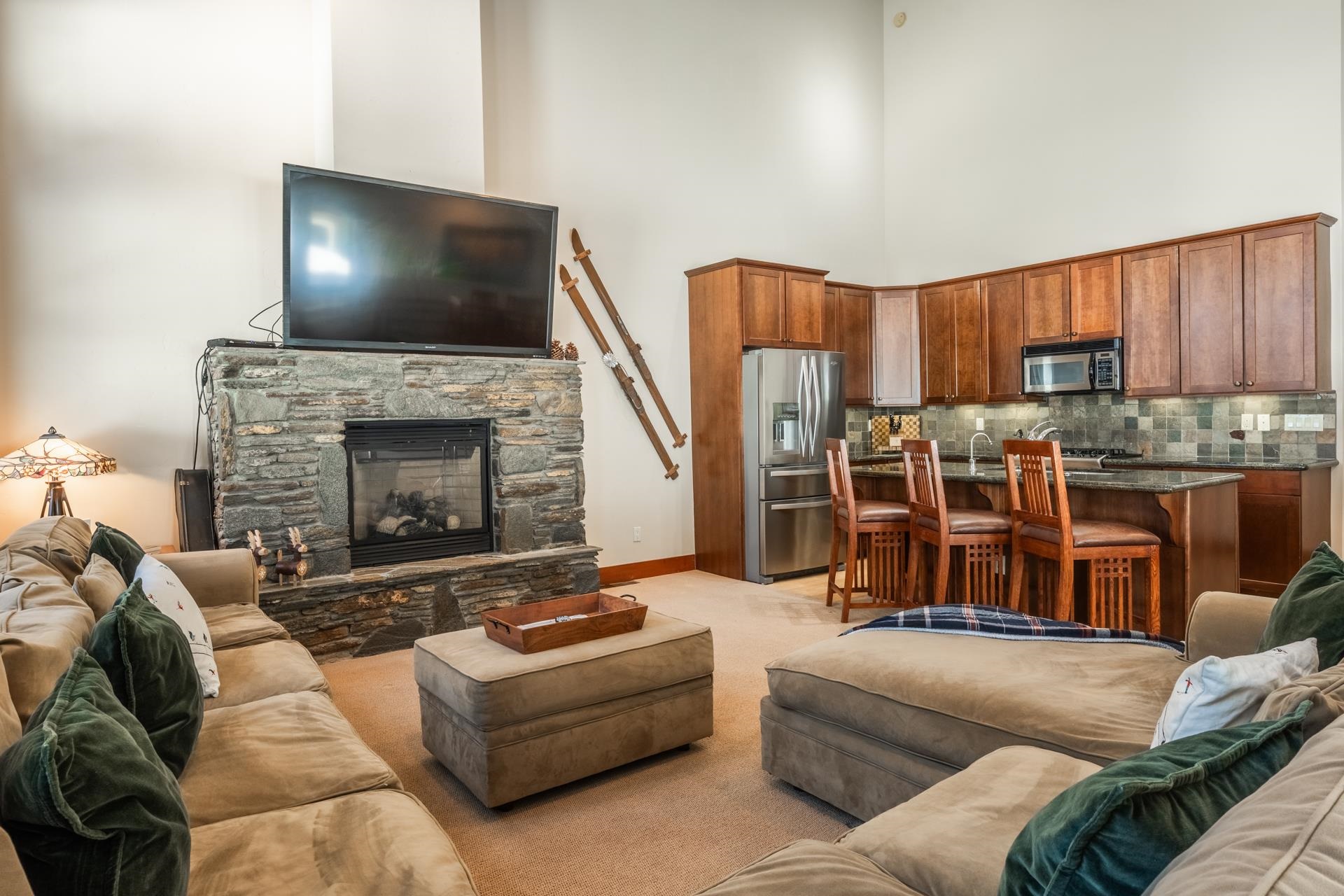 125 Davison Road, Unit 2 Mammoth Lakes, CA 93546 - Photo 19 of 50 a living room with furniture a flat screen tv and a fireplace