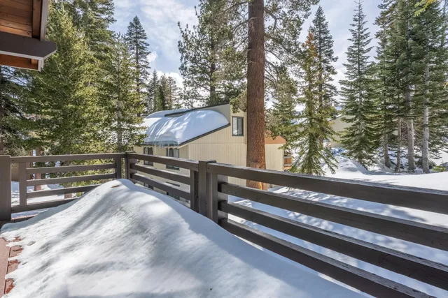 a view of backyard with wooden floor and outdoor seating