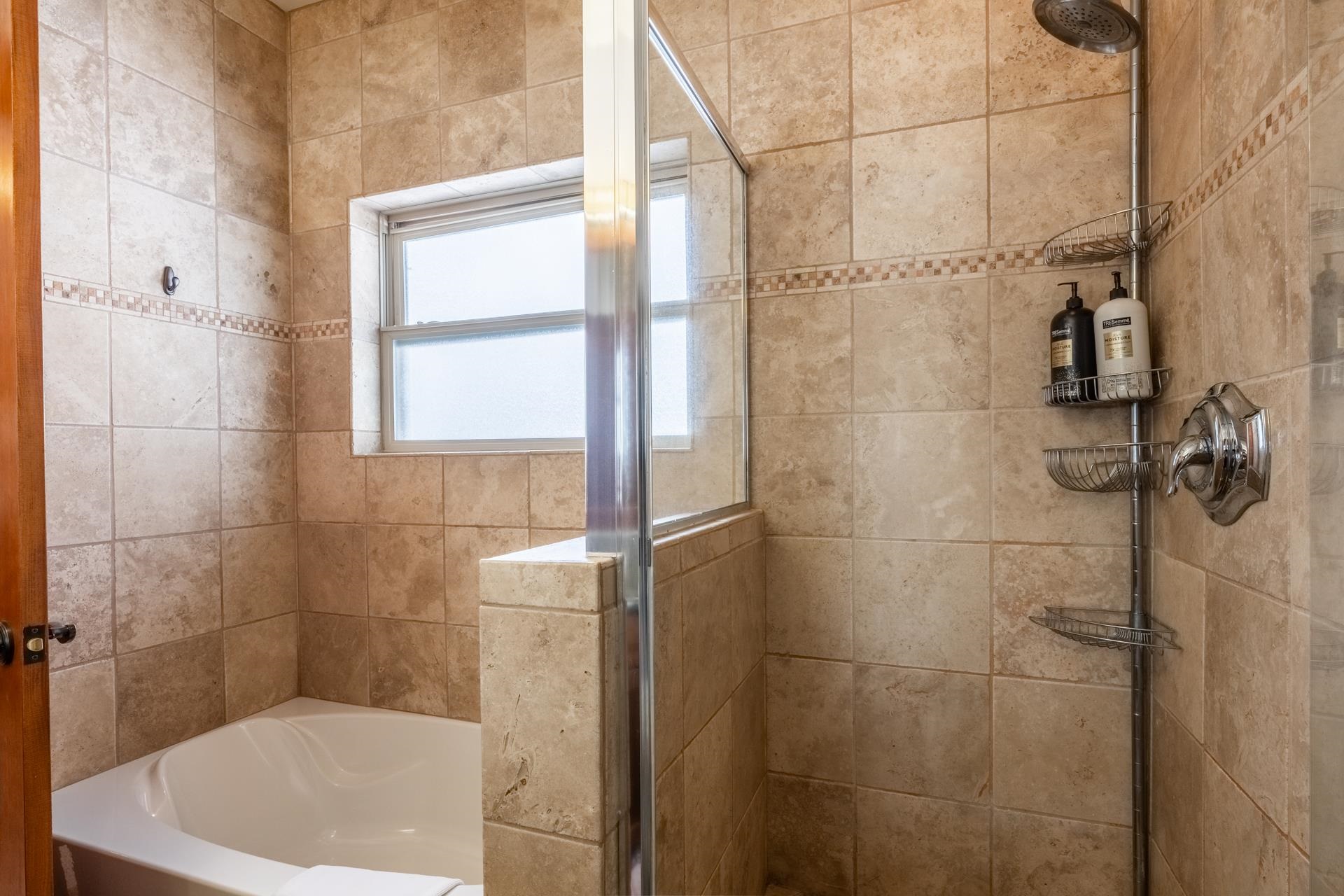 125 Davison Road, Unit 2 Mammoth Lakes, CA 93546 - Photo 26 of 50 a bath tub sitting next to a blue sink and a shower