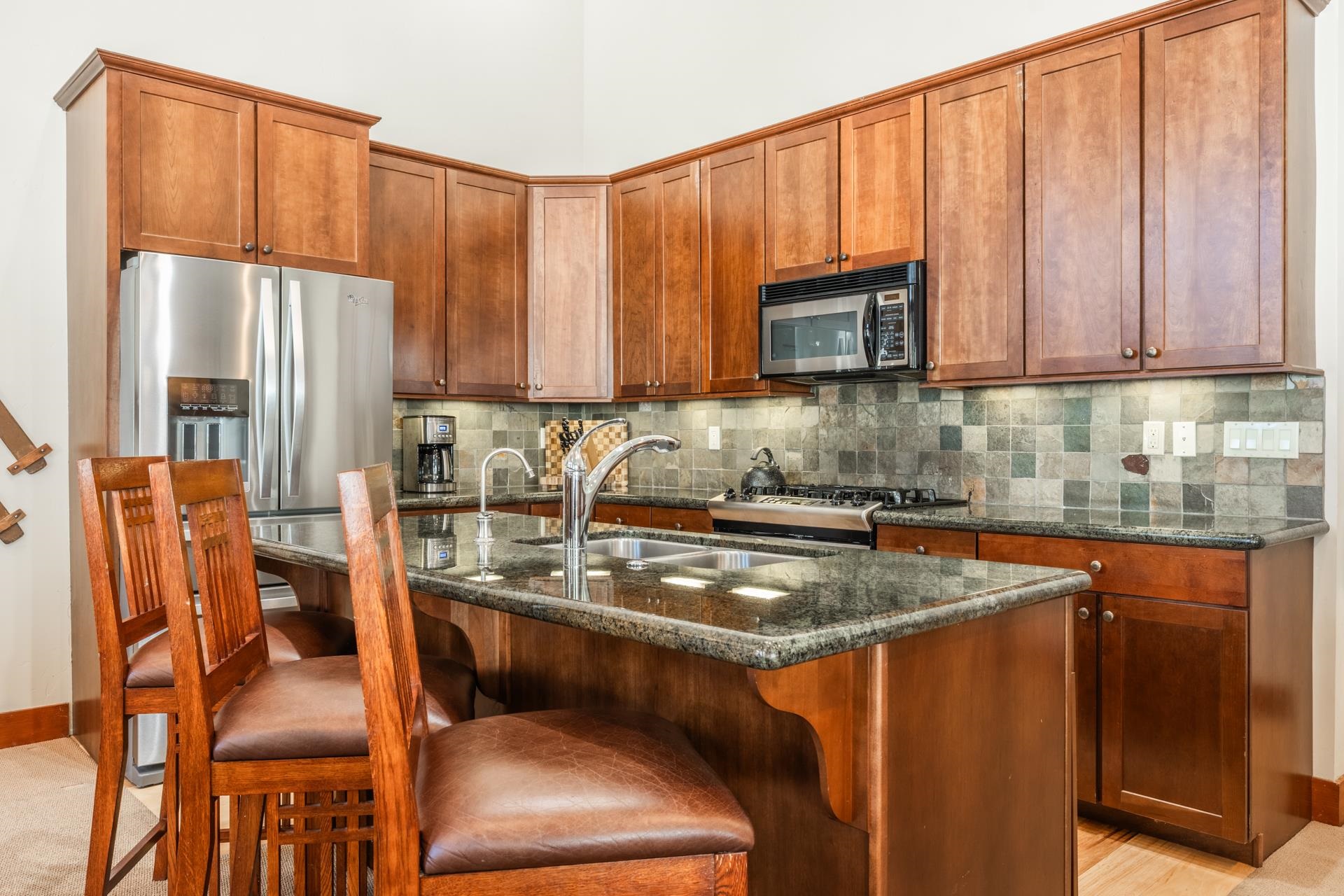 125 Davison Road, Unit 2 Mammoth Lakes, CA 93546 - Photo 3 of 50 a kitchen with stainless steel appliances granite countertop a refrigerator a stove a sink and dishwasher