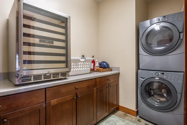 a utility room with sink dryer and washer